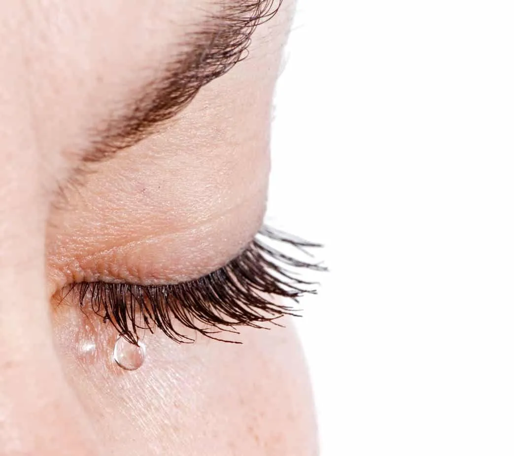 Sad woman eye crying after break up